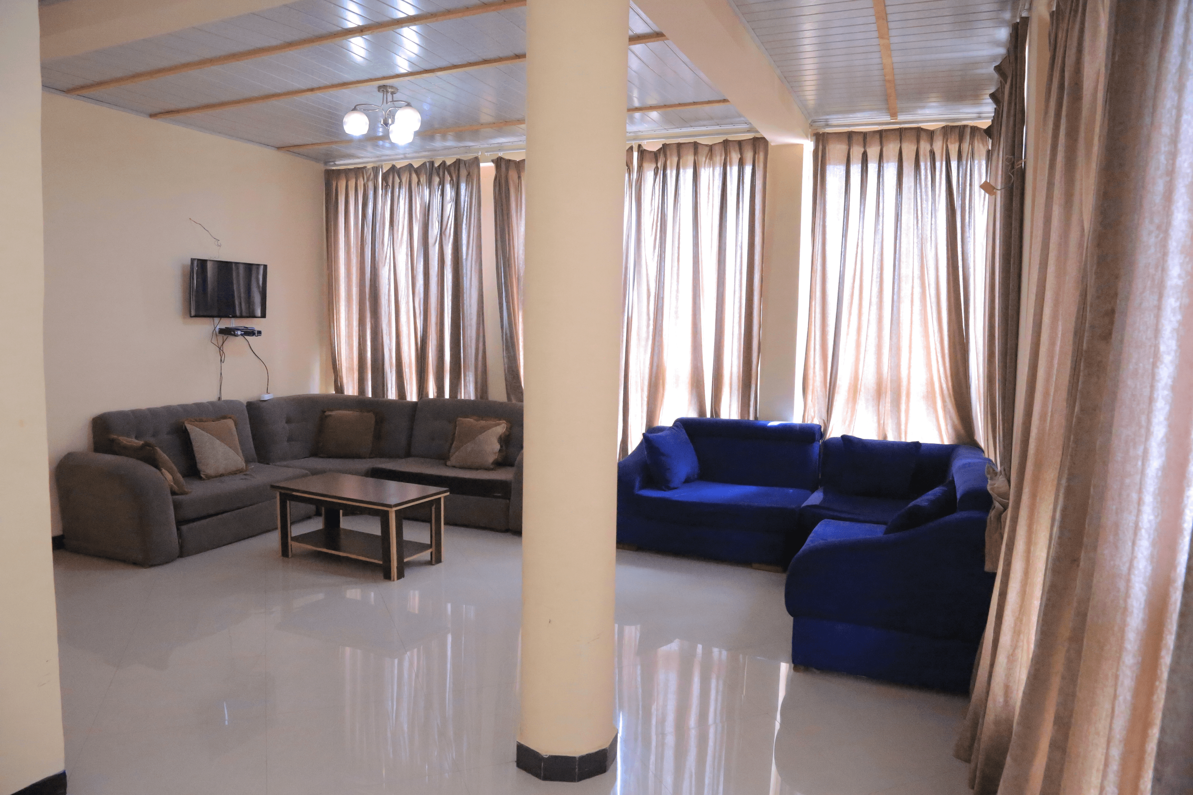 Exterior and interior view of a fully equipped guest house with multiple rooms in liyat guest house